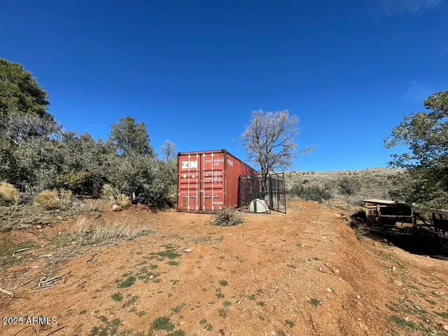 a view of a road with a building in the background
