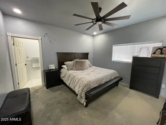 a bedroom with a bed and furniture