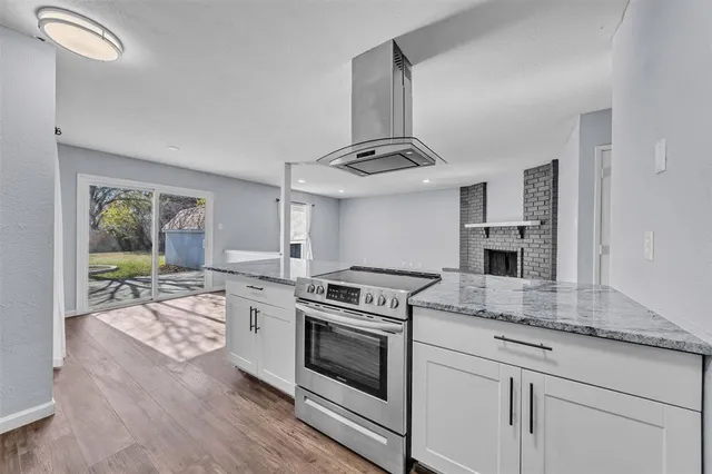 a kitchen with a stove oven and sink