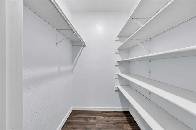 a view of an empty walk in closet