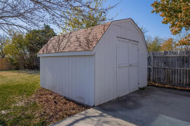 a view of a barn in the backyard