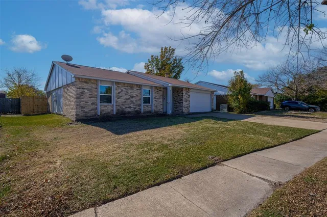 a view of a house with a garden