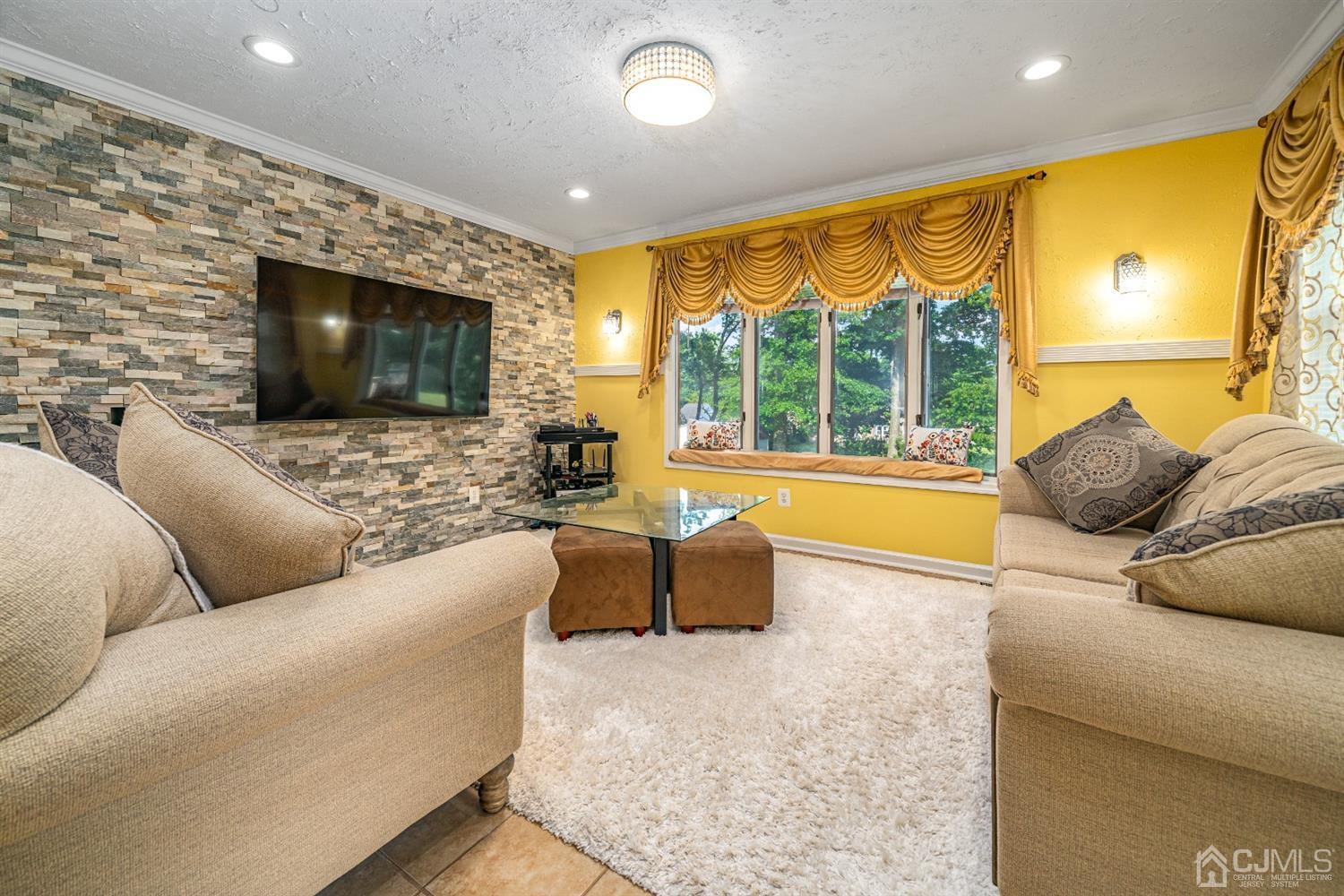 16 Hilltop Road Edison, NJ 08820 - Photo 12 of 30 a living room with furniture and a flat screen tv