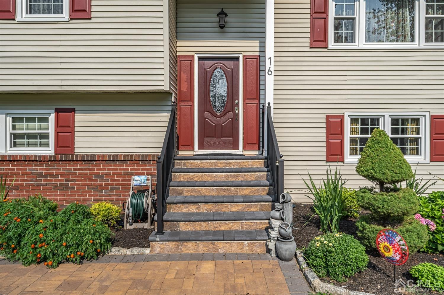 16 Hilltop Road Edison, NJ 08820 - Photo 3 of 30 a front view of a house with entryway