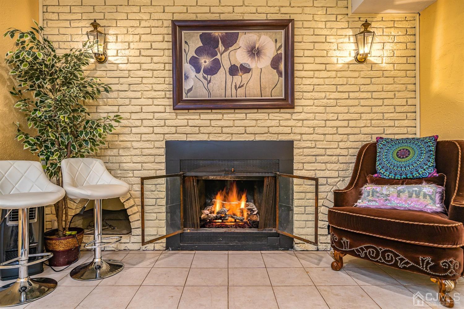 16 Hilltop Road Edison, NJ 08820 - Photo 21 of 30 a living room with a fireplace and a table