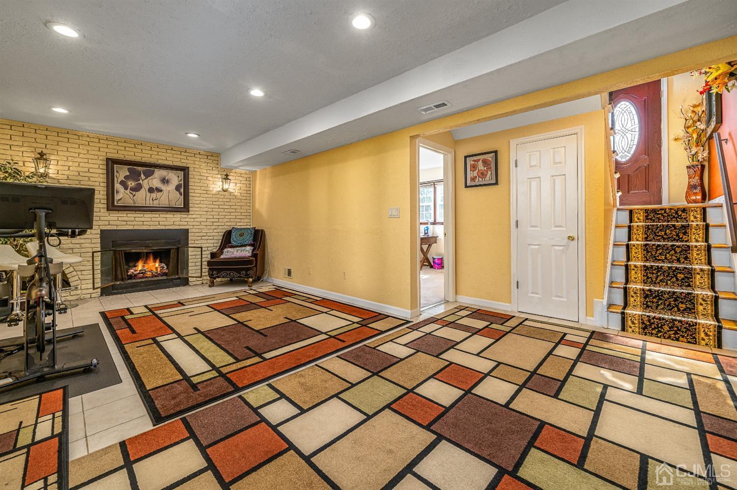 16 Hilltop Road Edison, NJ 08820 - Photo 23 of 30 a living room with a rug floor and a fireplace