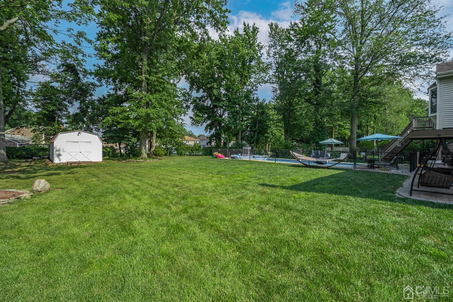 16 Hilltop Road Edison, NJ 08820 - Photo 24 of 30 a view of a park with plants and trees
