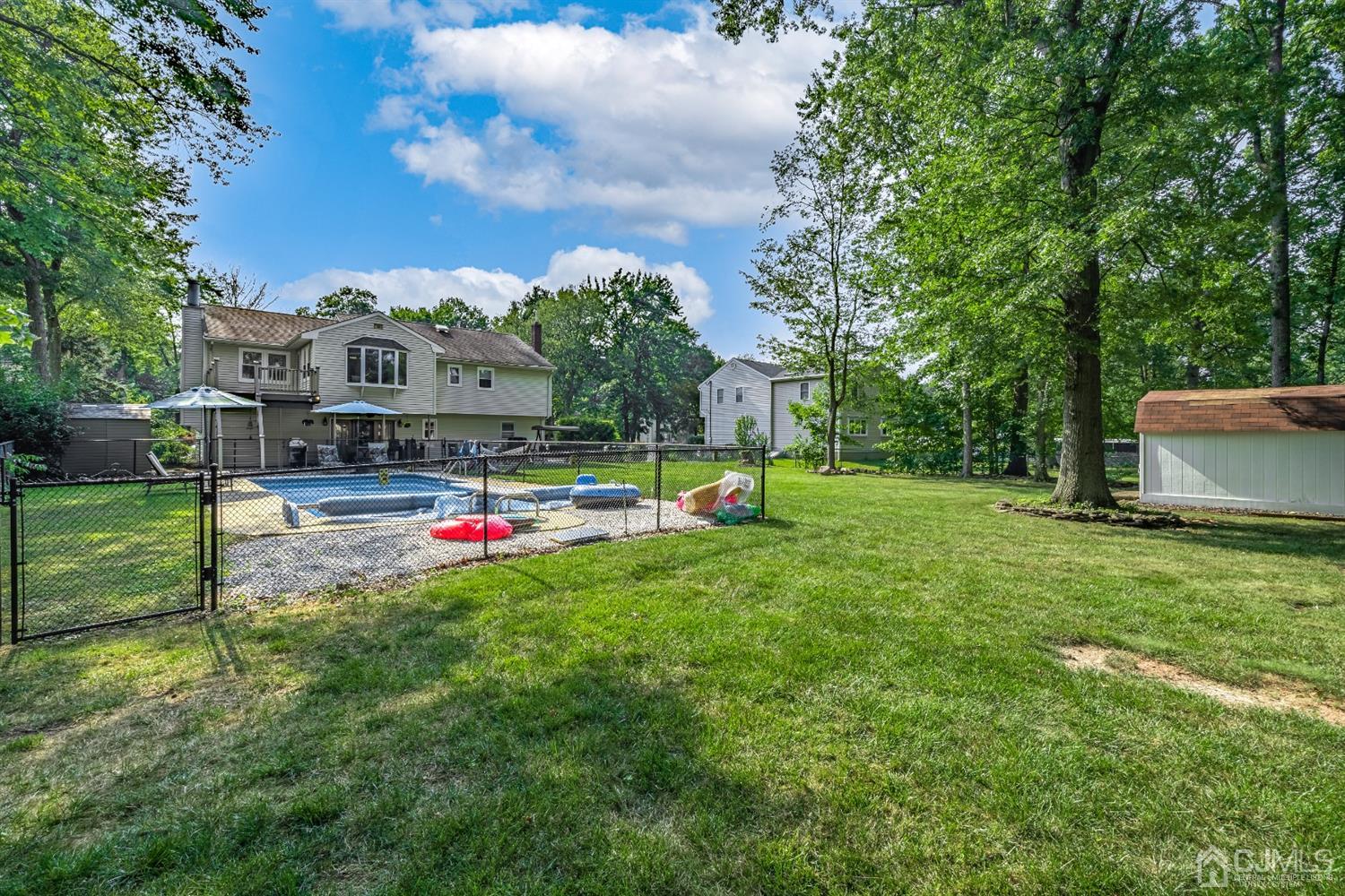 16 Hilltop Road Edison, NJ 08820 - Photo 26 of 30 a view of a park with swings and slides