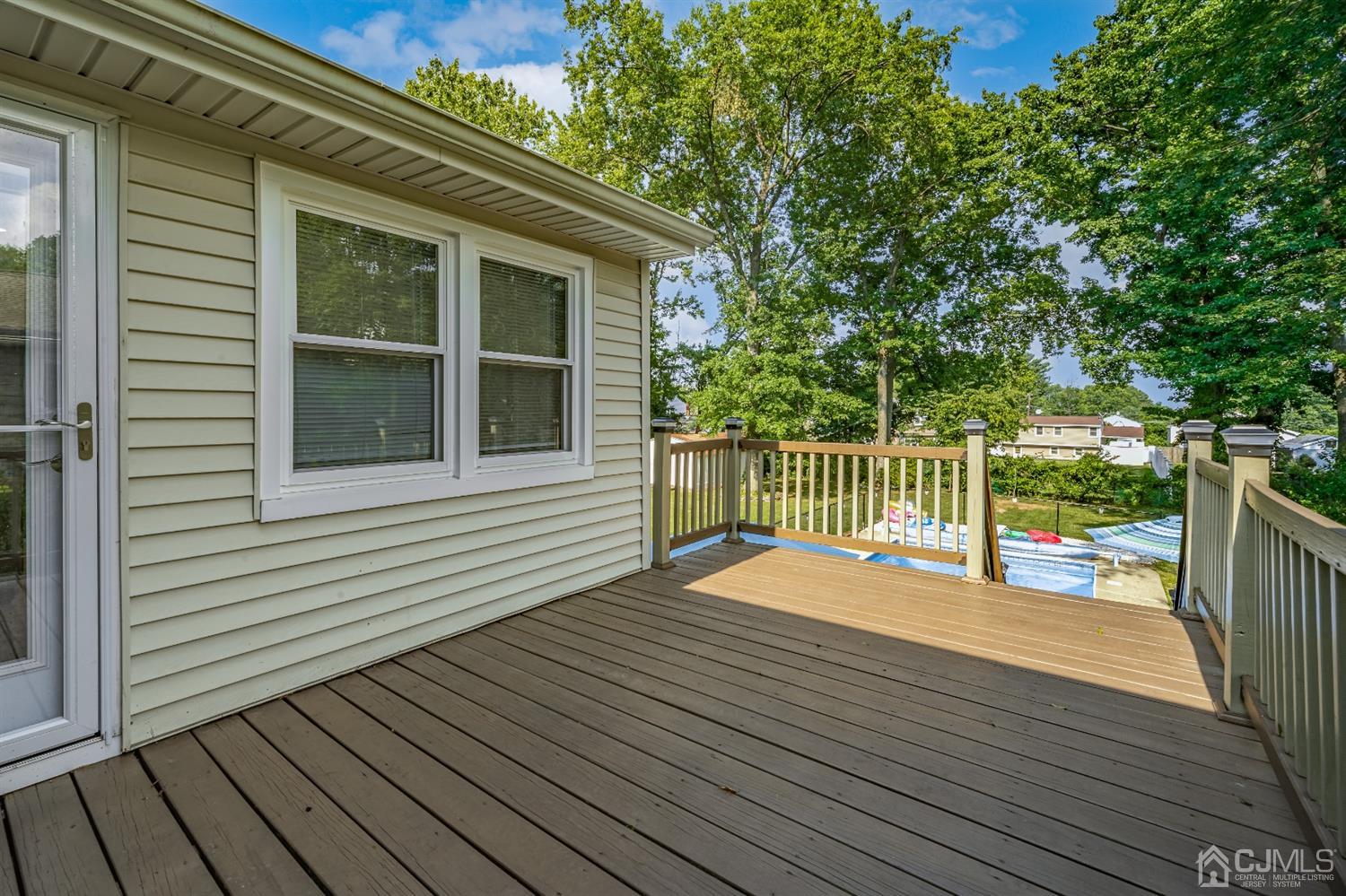 16 Hilltop Road Edison, NJ 08820 - Photo 29 of 30 a view of backyard with deck and wooden floor