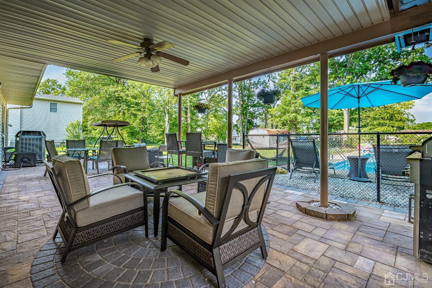 16 Hilltop Road Edison, NJ 08820 - Photo 30 of 30 a view of a patio with a table chairs and a backyard