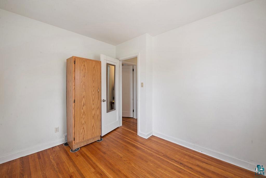 122 3rd Street Cloquet, MN 55720 - Photo 9 of 42 Warm wood-finish flooring complements crisp white walls