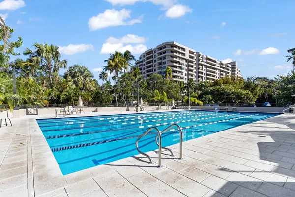 a view of a swimming pool with an outdoor space and seating area