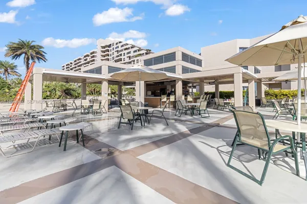 a view of swimming pool with outdoor seating