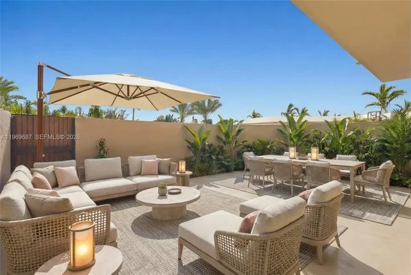 a patio with patio a couch and chairs