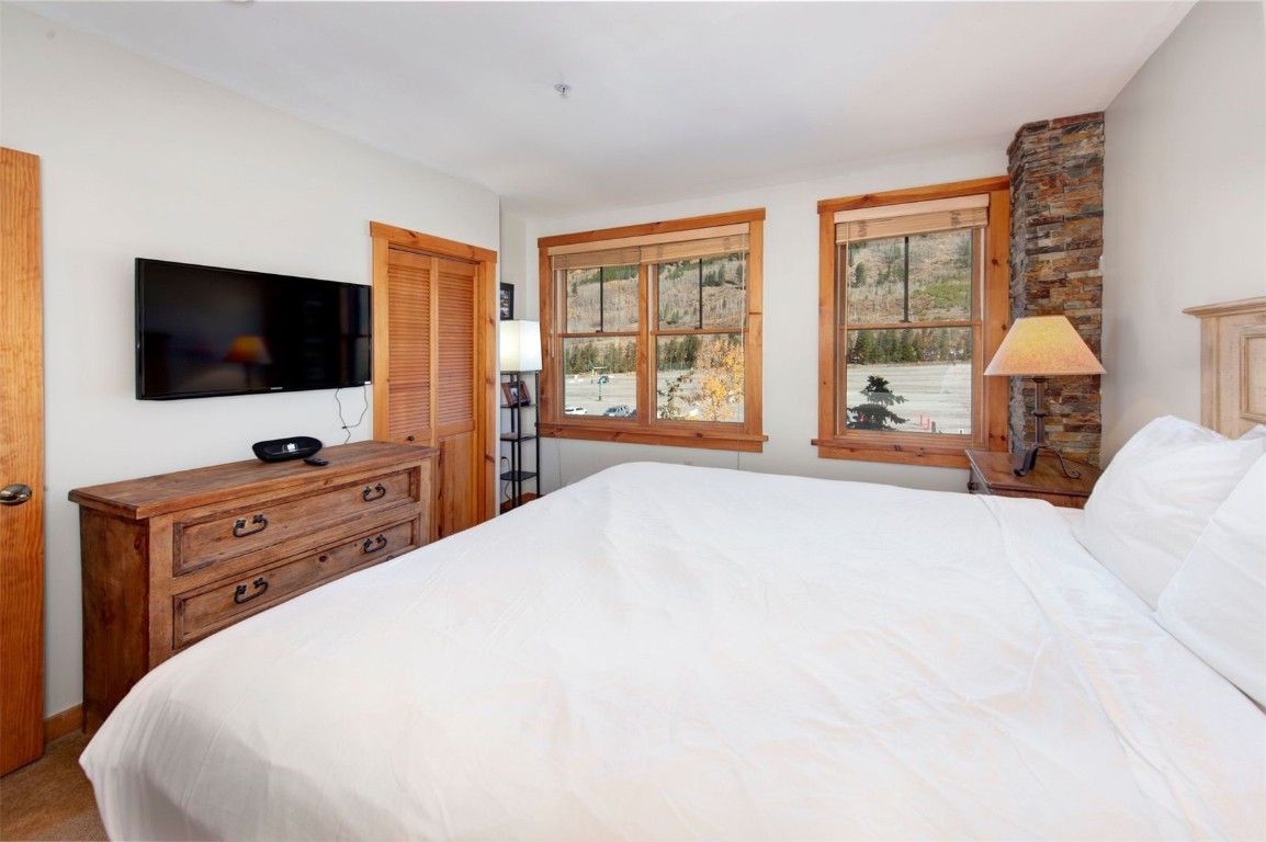 100 Dercum Square, Unit 8362 Keystone, CO 80435 - Photo 12 of 35 a bedroom with a bed and a flat screen tv
