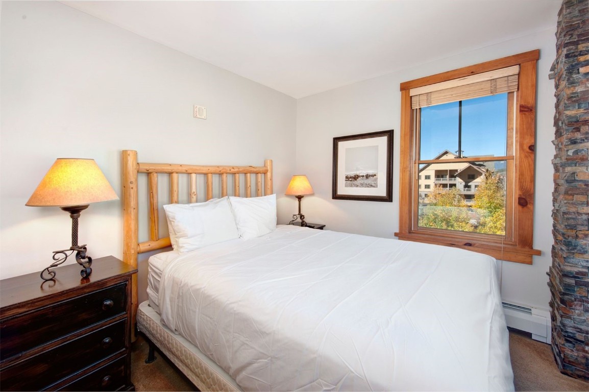 100 Dercum Square, Unit 8362 Keystone, CO 80435 - Photo 17 of 35 a bedroom with a bed and painting on the wall
