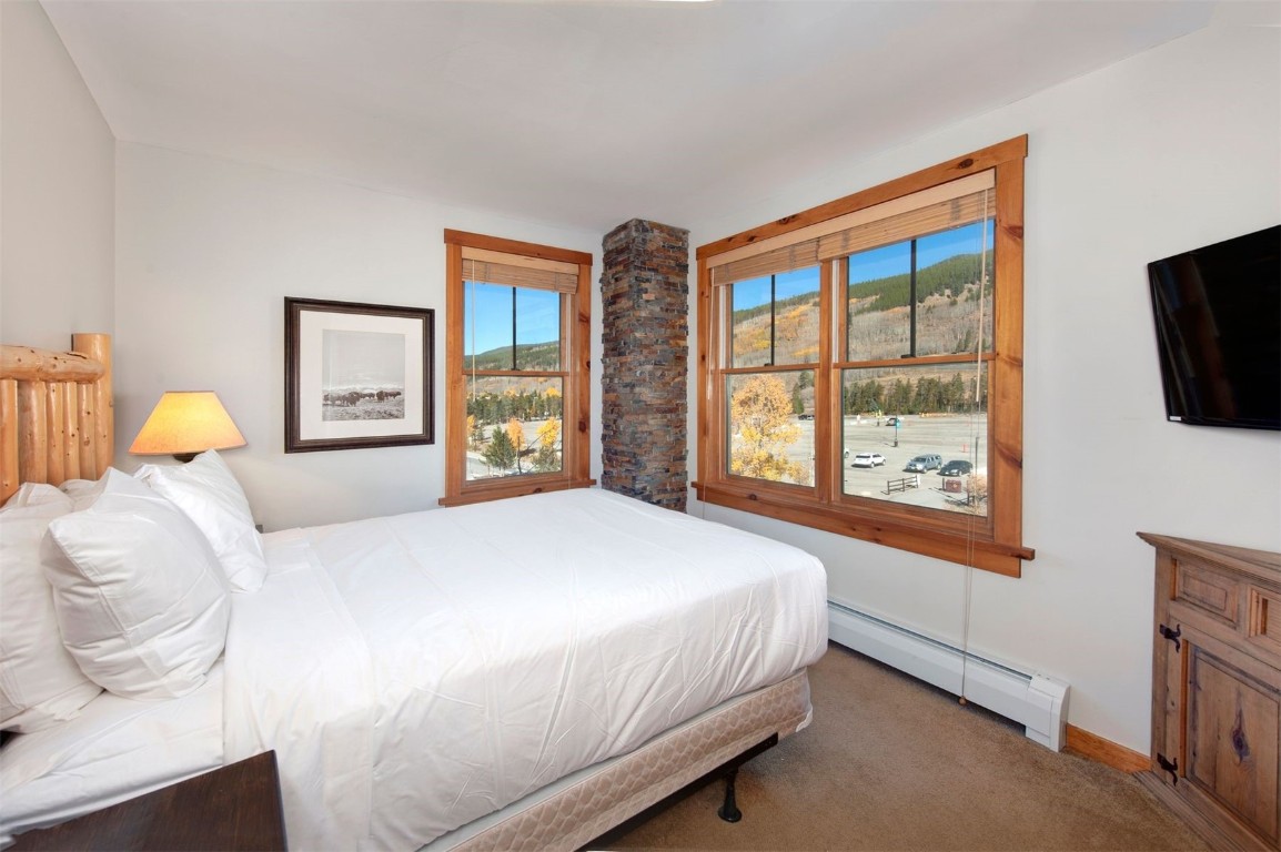 100 Dercum Square, Unit 8362 Keystone, CO 80435 - Photo 18 of 35 a bedroom with a large bed and a large window