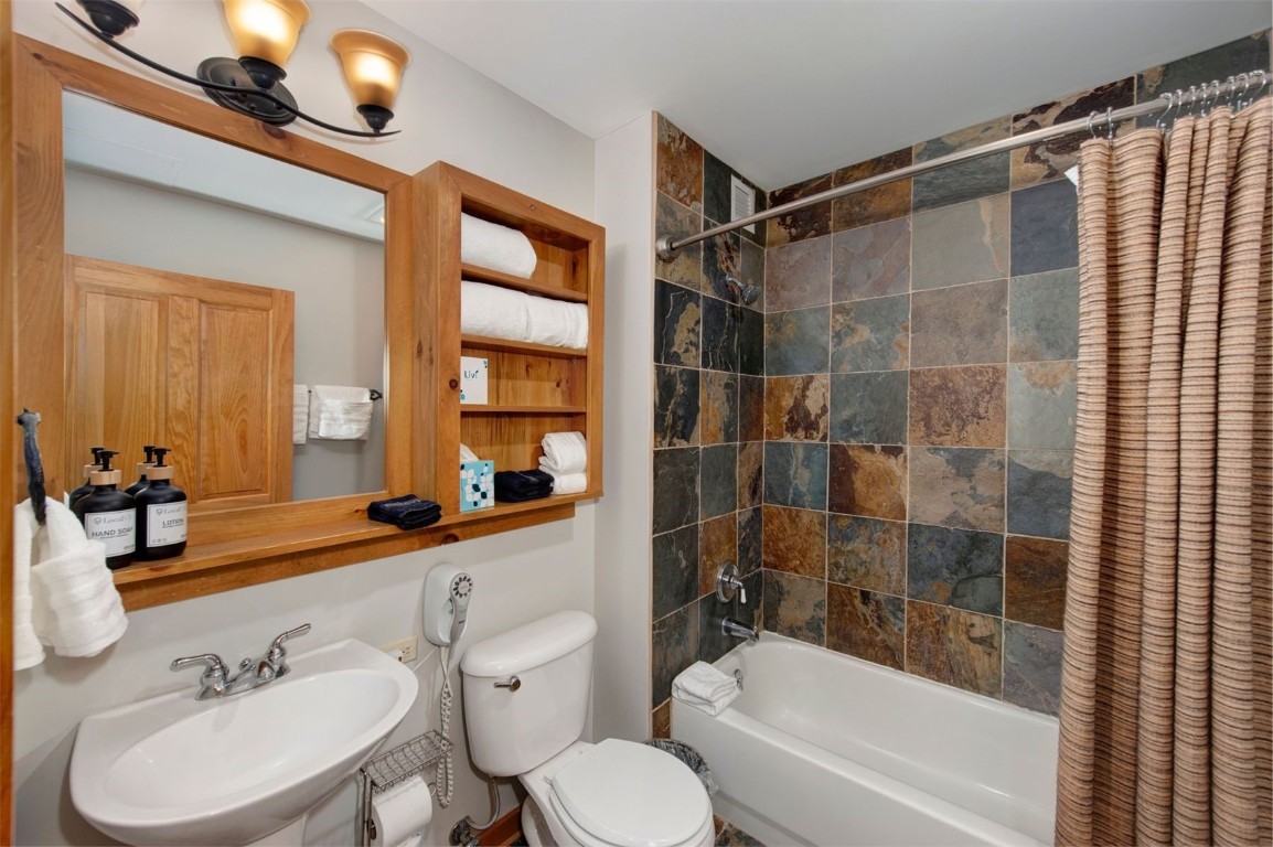 100 Dercum Square, Unit 8362 Keystone, CO 80435 - Photo 20 of 35 a bathroom with a sink toilet a mirror and shower