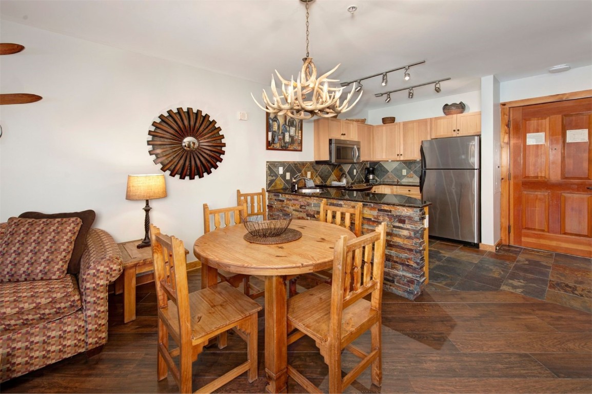100 Dercum Square, Unit 8362 Keystone, CO 80435 - Photo 6 of 35 a view of a dining room with furniture and a chandelier