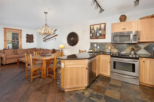 a kitchen with a sink cabinets and window