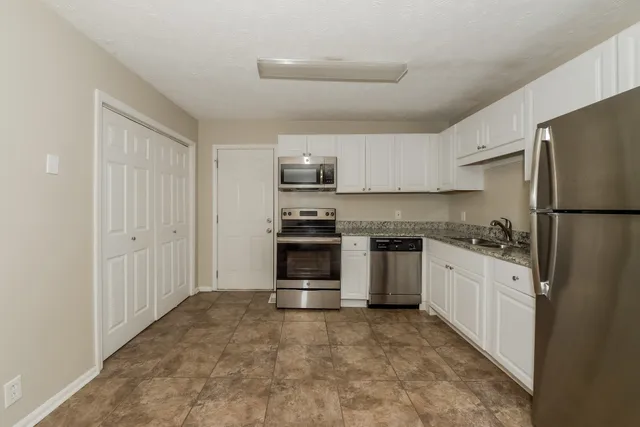 a picture of a park with an bench