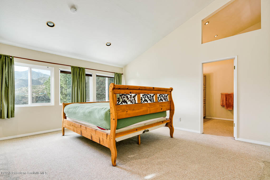 4329 El Prieto Road Altadena, CA 91001 - Photo 13 of 28 a bed sitting in a room next to a window