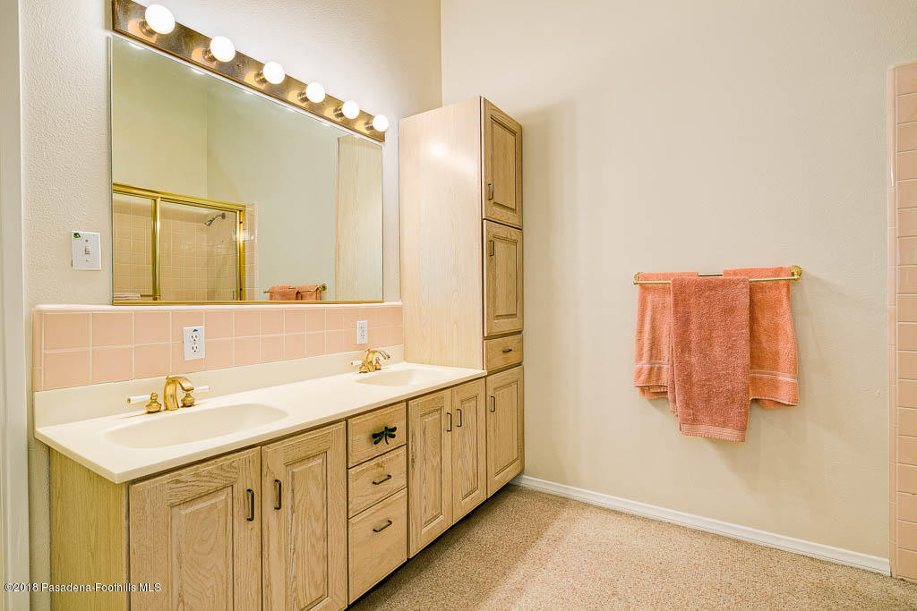 4329 El Prieto Road Altadena, CA 91001 - Photo 15 of 28 a bathroom with a double vanity sink mirror and