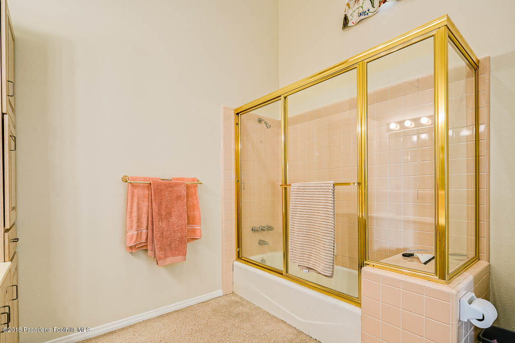 4329 El Prieto Road Altadena, CA 91001 - Photo 16 of 28 a bathroom with a bathtub and a shower