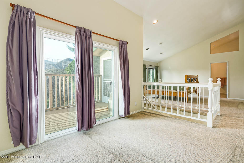 4329 El Prieto Road Altadena, CA 91001 - Photo 17 of 28 a view of a bedroom with wooden floor and windows