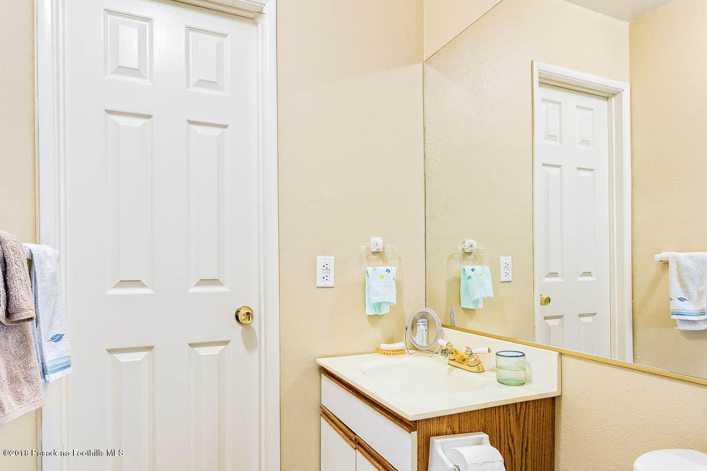 4329 El Prieto Road Altadena, CA 91001 - Photo 18 of 28 a bathroom with a sink vanity and a mirror
