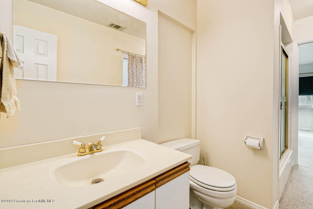 4329 El Prieto Road Altadena, CA 91001 - Photo 19 of 28 a bathroom with a sink toilet and mirror
