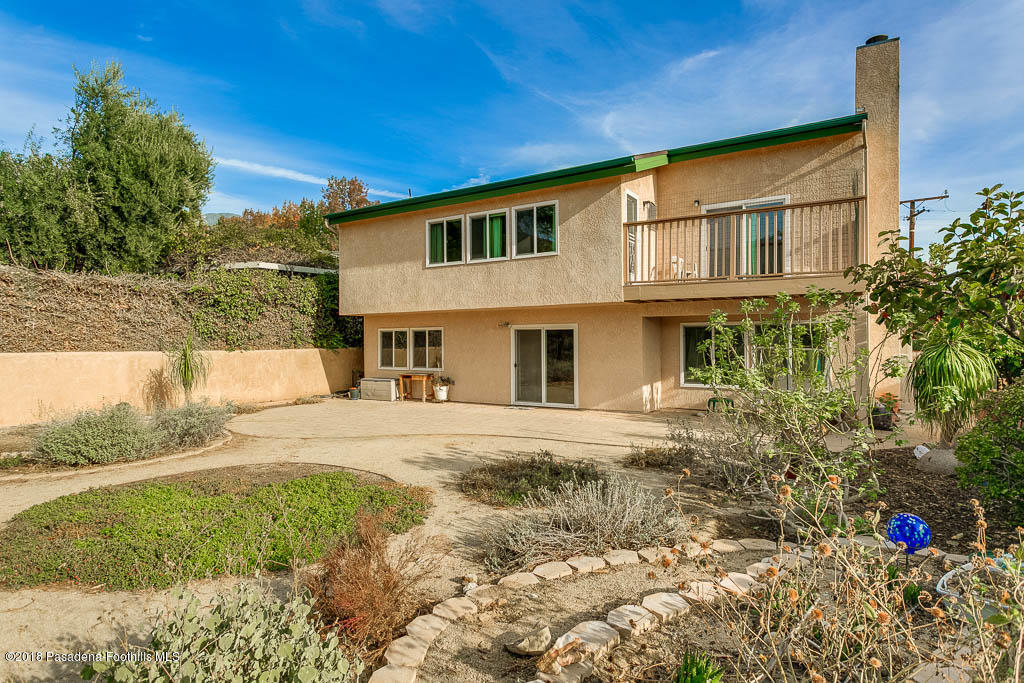 4329 El Prieto Road Altadena, CA 91001 - Photo 23 of 28 a front view of a house with a yard