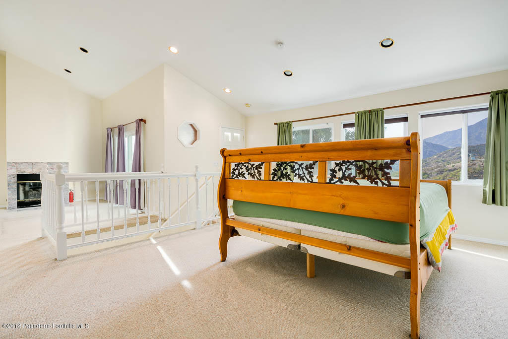 4329 El Prieto Road Altadena, CA 91001 - Photo 6 of 28 a bedroom with furniture and window