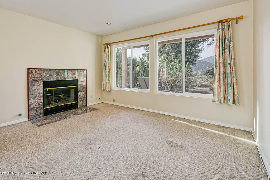 4329 El Prieto Road Altadena, CA 91001 - Photo 9 of 28 a view of empty room with furniture and a fireplace