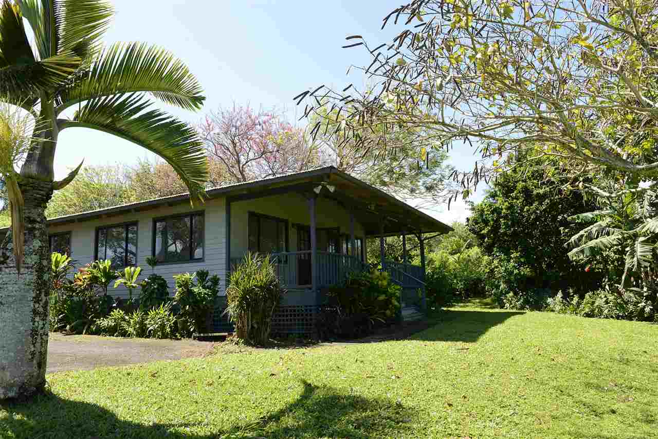 913 Hog Back Road Haiku, HI 96708 - Photo 11 of 18 a view of a house with a yard