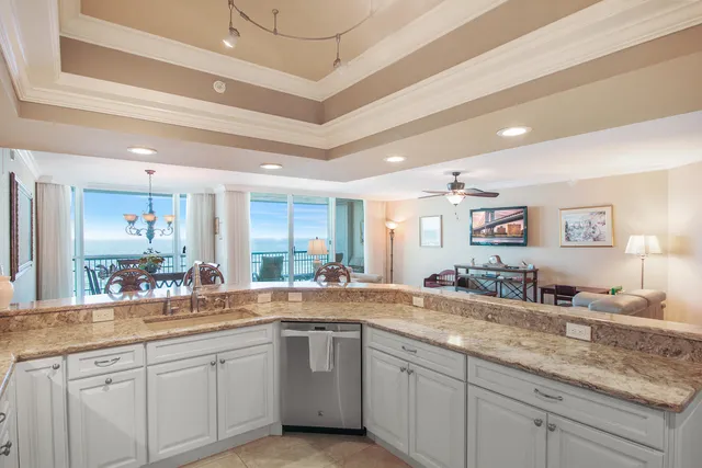 a bathroom with double vanity sinks and a large mirror