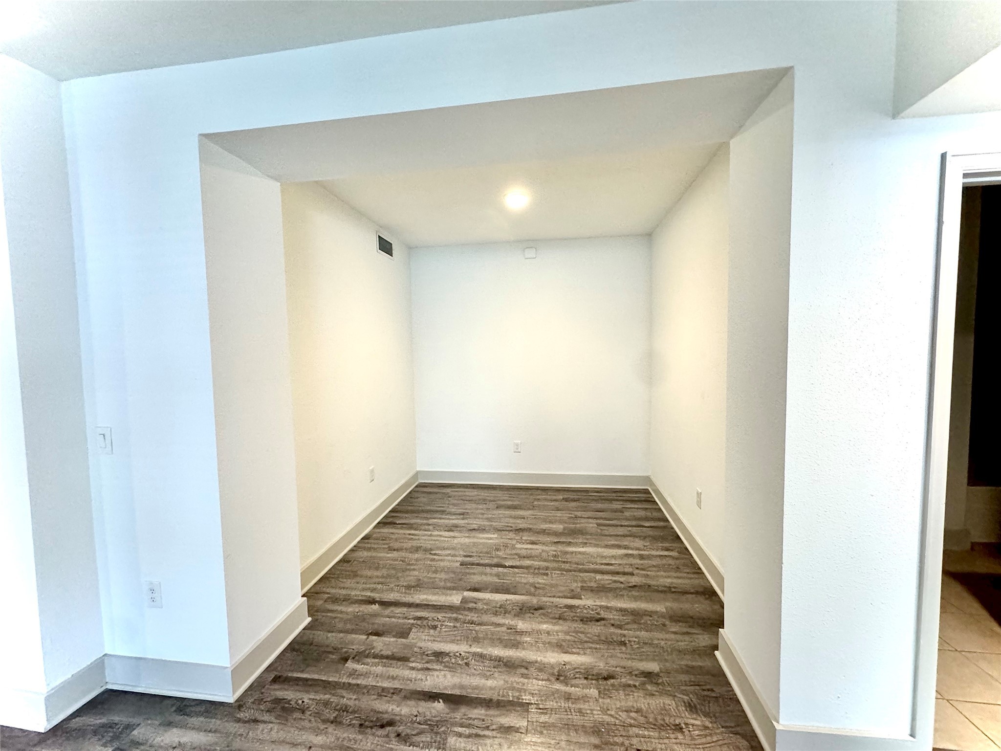 2222 Smith Street, Unit 225 Houston, TX 77002 - Photo 3 of 19 a view of a hallway with wooden floor
