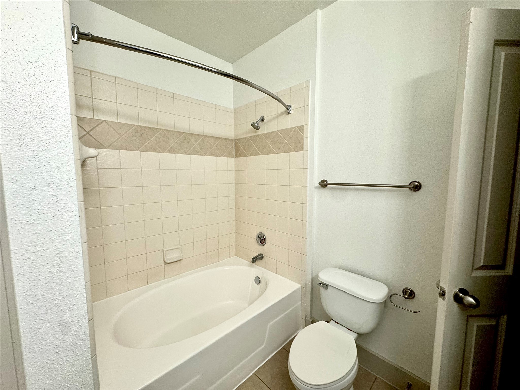 2222 Smith Street, Unit 225 Houston, TX 77002 - Photo 5 of 19 a white bath tub sitting next to a white toilet and sink