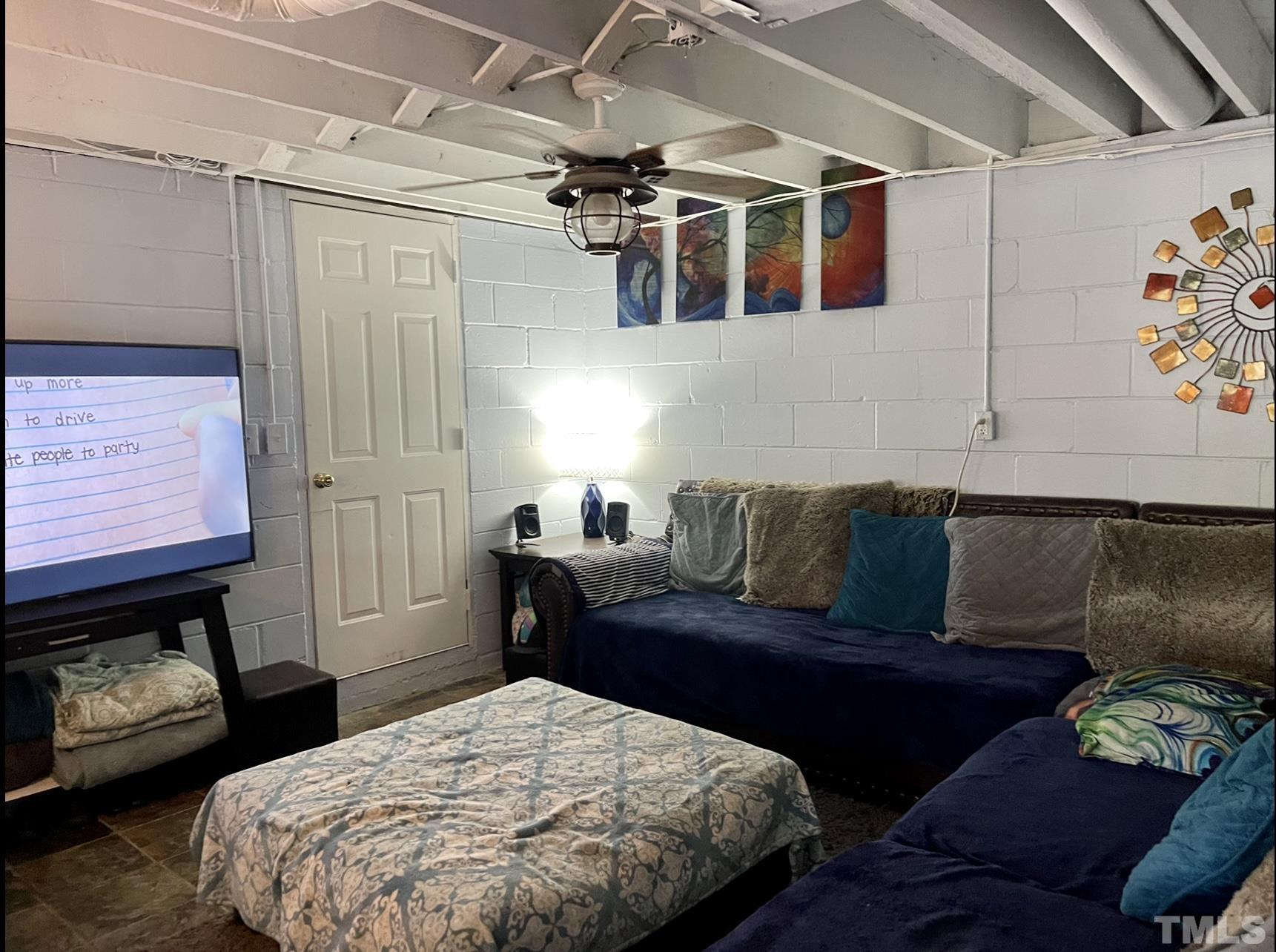 308 Parham Road Henderson, NC 27536 - Photo 7 of 27 a bedroom with a bed and a couch