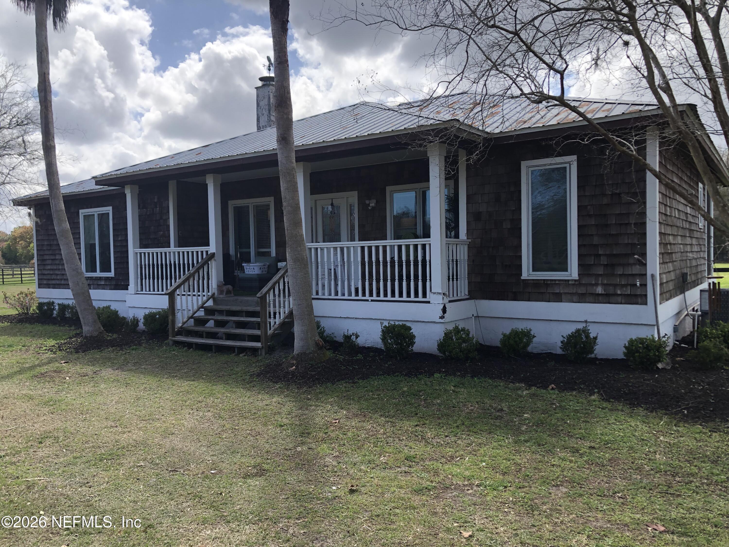 5100 Silo Road St. Augustine, FL 32092 - Photo 3 of 9 a view of a house with a yard and sitting area