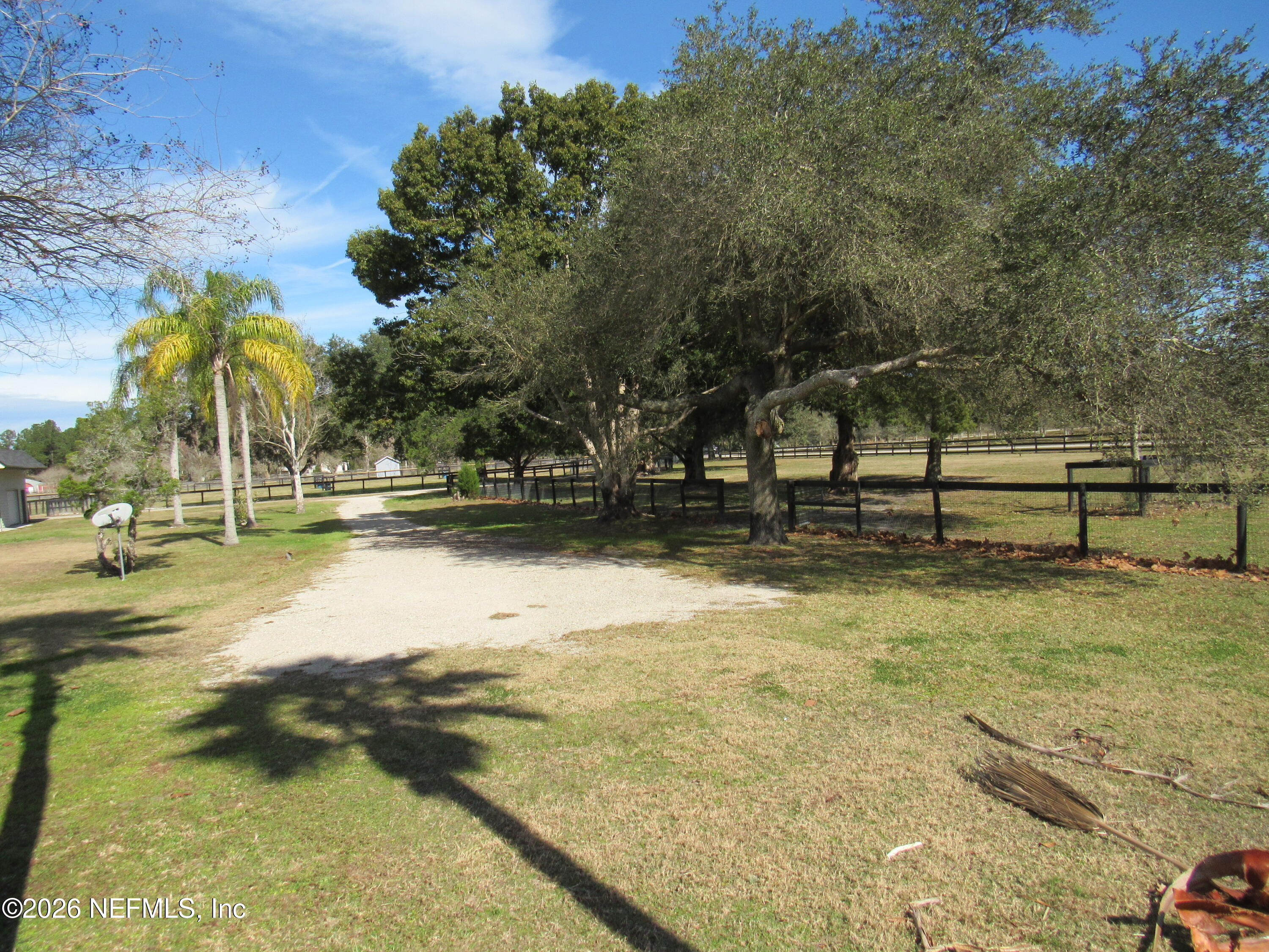 5100 Silo Road St. Augustine, FL 32092 - Photo 6 of 9 a view of swimming pool with outdoor seating and trees