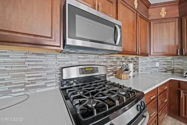 a kitchen with a stove and a microwave