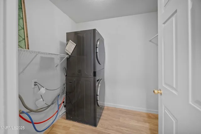 a spacious bathroom with double vanity a mirror and a shower