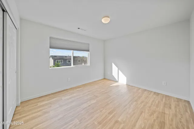 a bedroom with a bed and a table