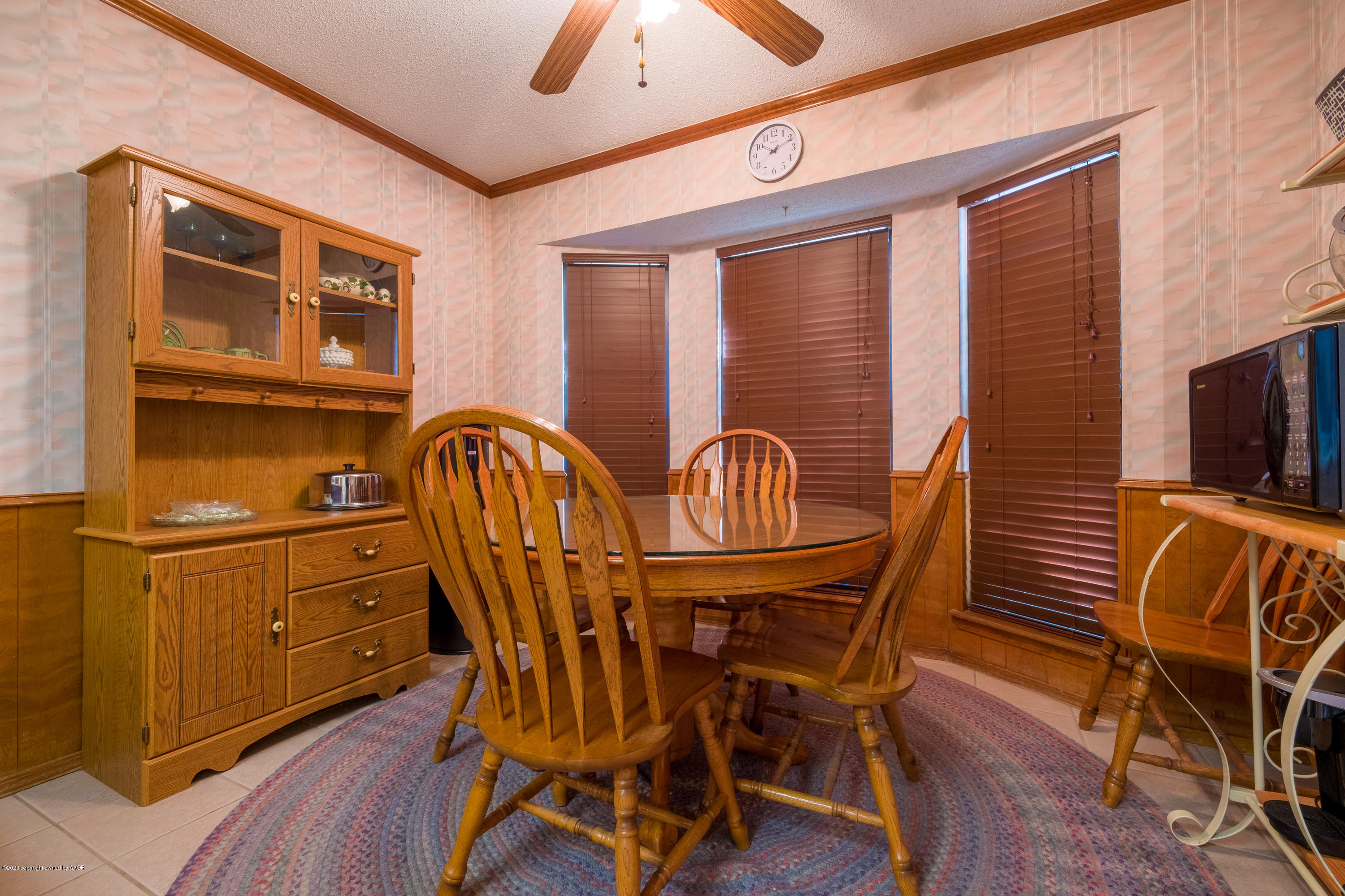 5718 South Fannin Street Amarillo, TX 79110 - Photo 13 of 31 a view of a dining room with furniture window and wooden floor