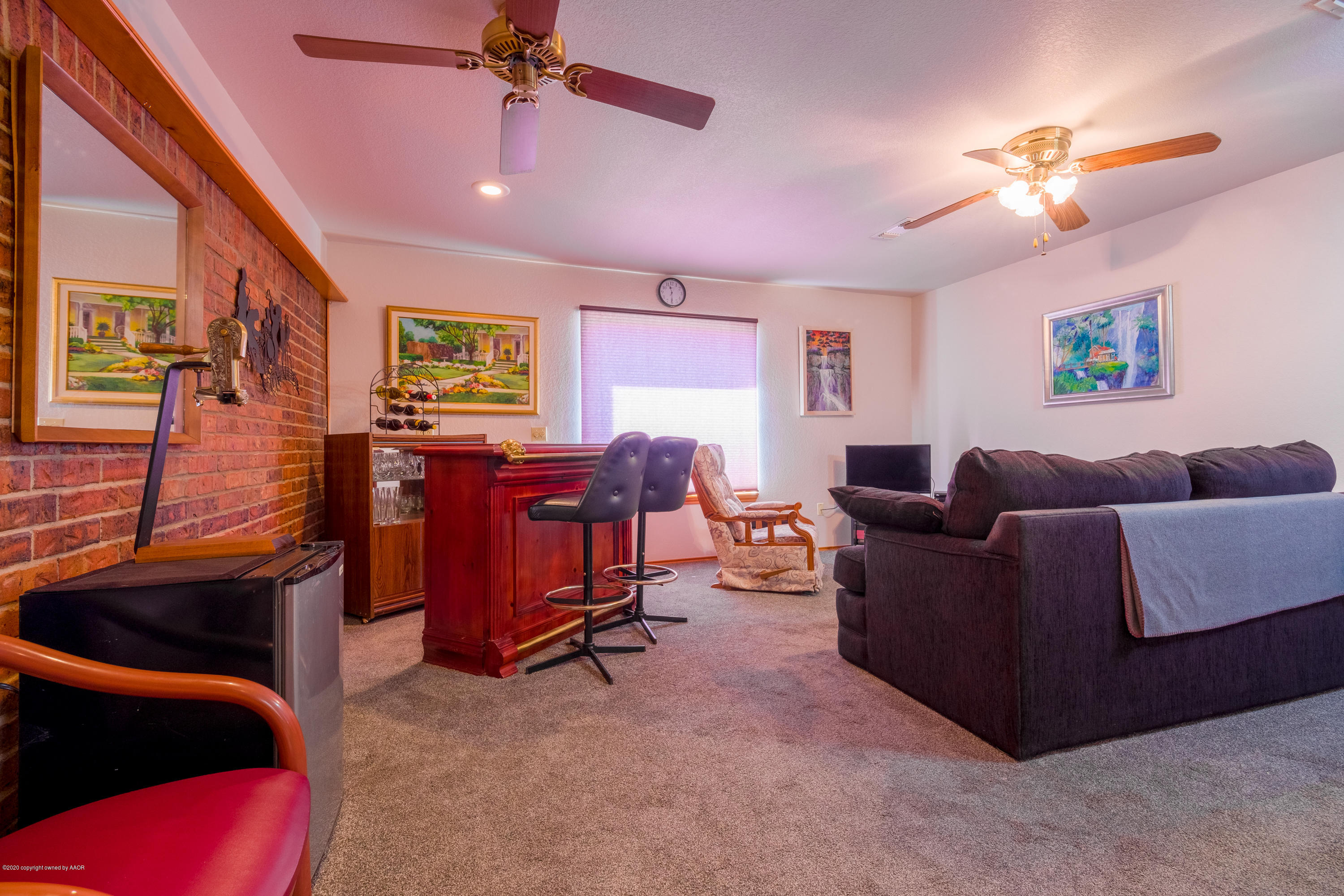 5718 South Fannin Street Amarillo, TX 79110 - Photo 14 of 31 a living room with furniture and a ceiling fan