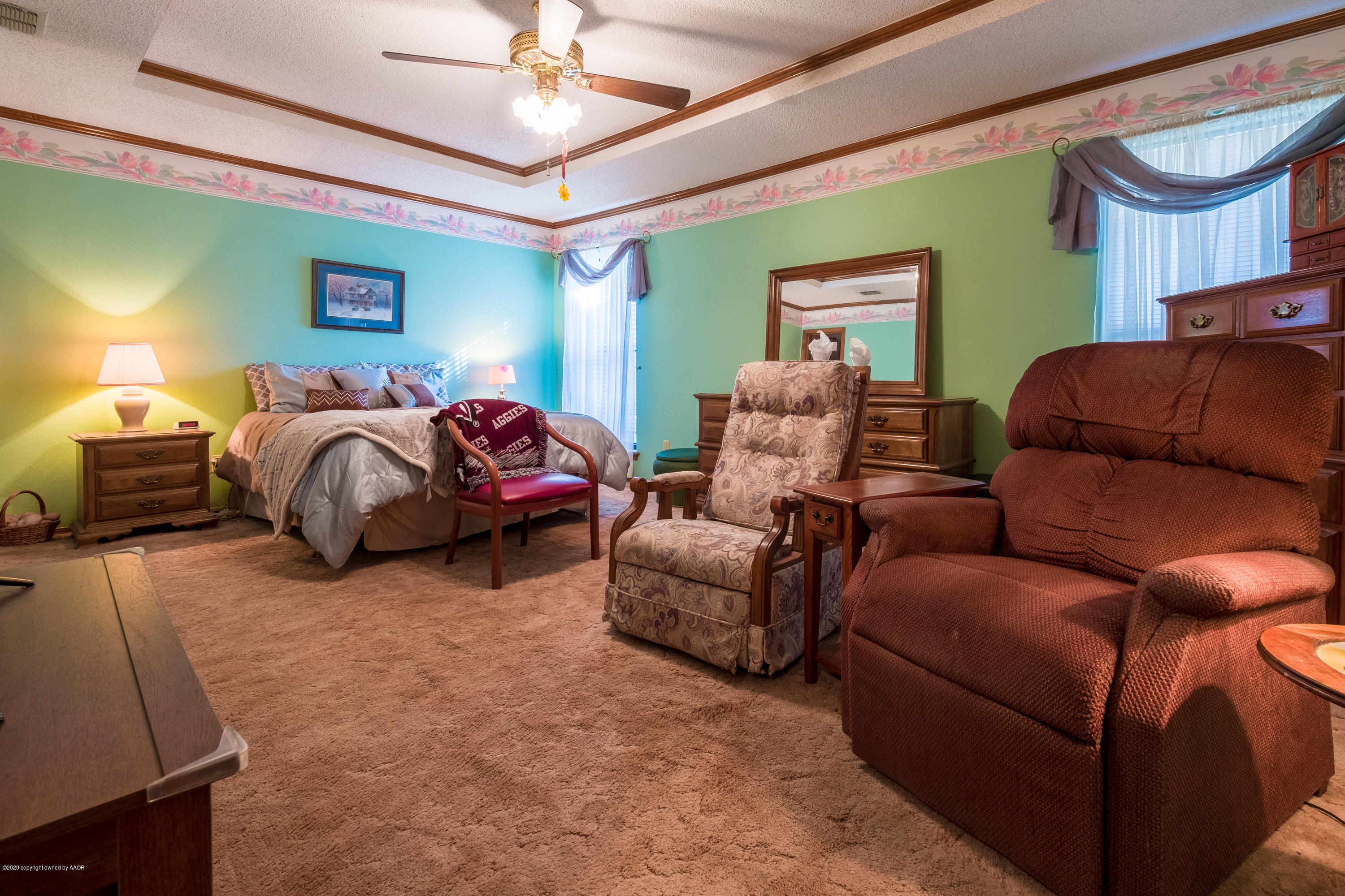 5718 South Fannin Street Amarillo, TX 79110 - Photo 17 of 31 a living room with furniture and a lamp
