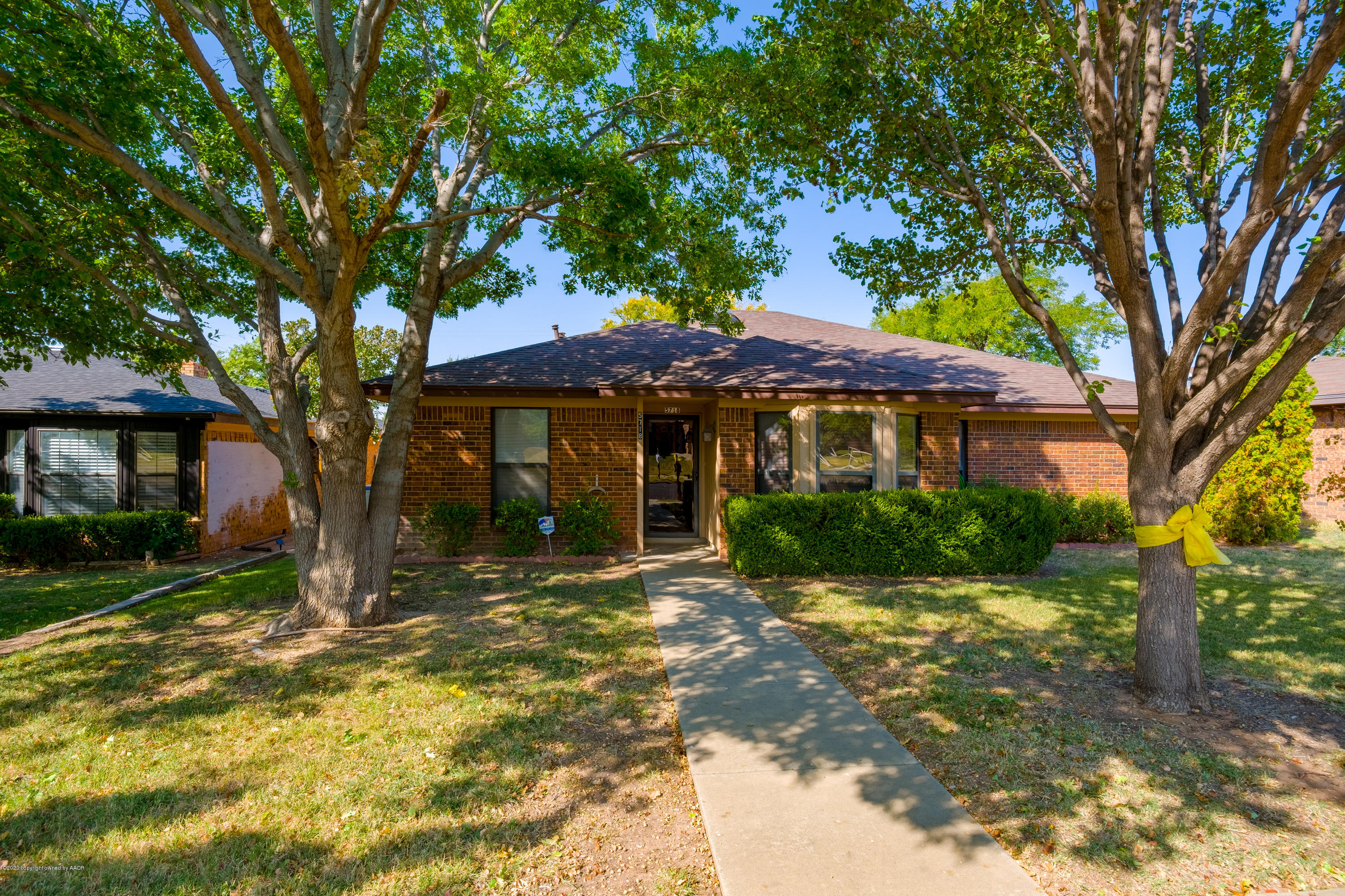 5718 South Fannin Street Amarillo, TX 79110 - Photo 2 of 31 a front view of a house with a yard