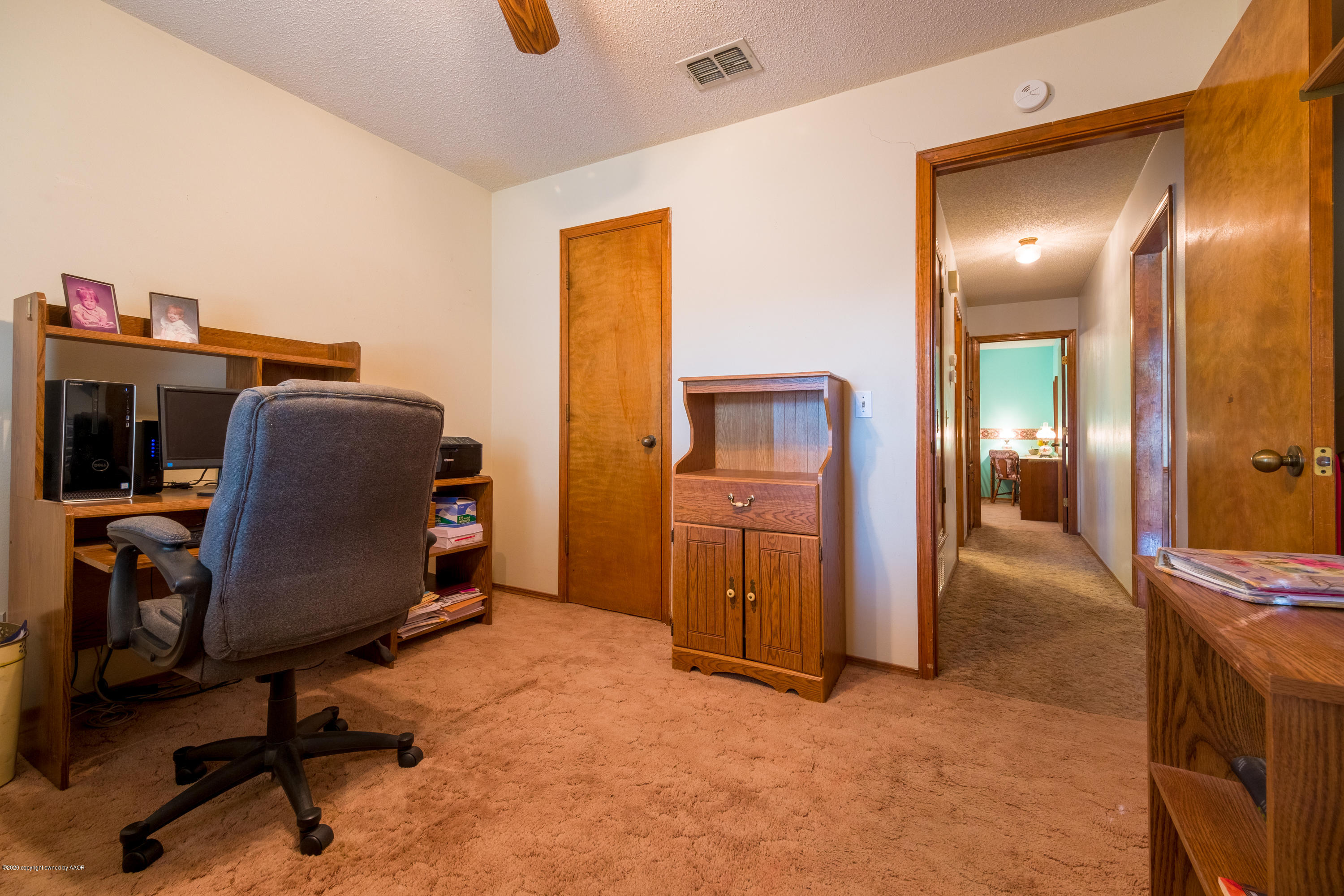 5718 South Fannin Street Amarillo, TX 79110 - Photo 21 of 31 a view of a workspace with furniture and mirror