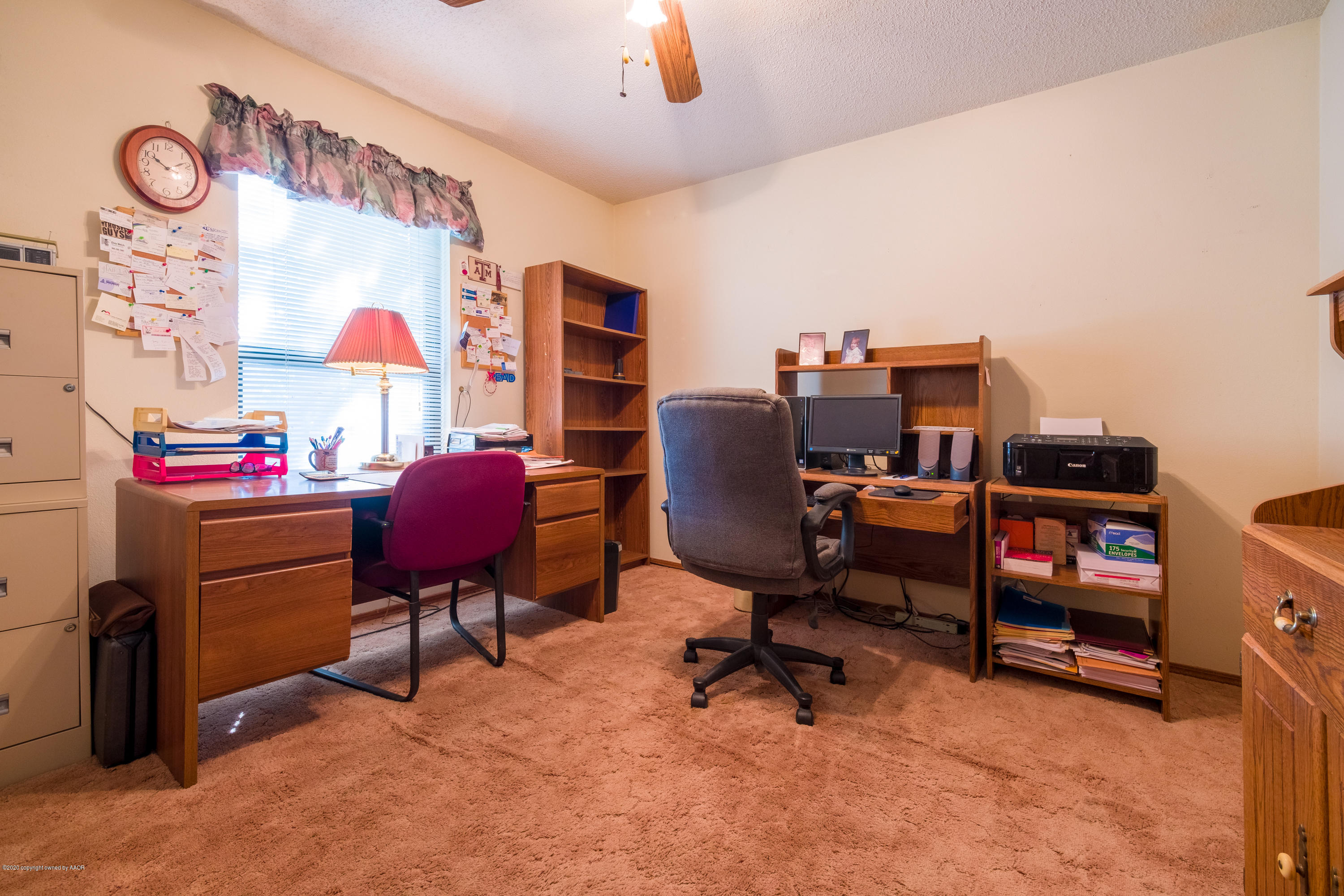 5718 South Fannin Street Amarillo, TX 79110 - Photo 22 of 31 a view of a workspace with furniture and a window